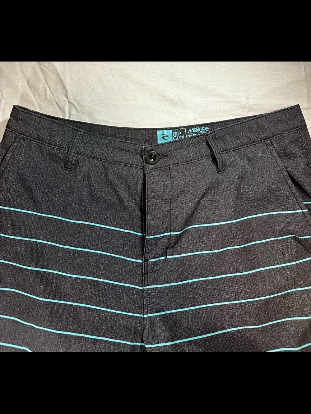 Rip Curl Men’s Black Shorts with Teal Stripe Accents